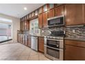 Kitchen with stainless steel appliances and wood cabinets at 5956 Lambert Bridge Ave, Las Vegas, NV 89139
