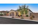Single-story house with a two-car garage and nicely landscaped front yard at 6160 Lautman Ridge Ct, Las Vegas, NV 89141