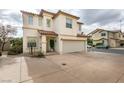 Two-story house with attached garage, driveway and landscaping at 9100 Spoonbill Ridge Pl, Las Vegas, NV 89143