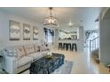 Open living area with light flooring and a fireplace at 9100 Spoonbill Ridge Pl, Las Vegas, NV 89143