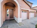 Front entry with double doors and brick paver driveway at 9632 Staff Ln, Las Vegas, NV 89178