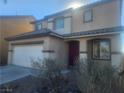 Two-story house with attached garage and red front door at 3513 Kendall Point Ave, North Las Vegas, NV 89081