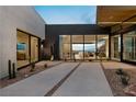 Private courtyard with gravel pathways, drought-tolerant landscaping, and views at 705 Dragon Peak Dr, Henderson, NV 89012