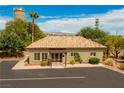 Building exterior showcasing Spanish-style tile roof and landscaping at 799 Bluebird Dr, Boulder City, NV 89005