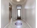 Bright entryway with tiled floor and mosaic detail at 869 Ashford Way, Henderson, NV 89015