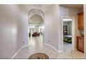 Elegant hallway with arched entryways to living spaces at 869 Ashford Way, Henderson, NV 89015
