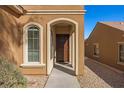 Side entry to the home with arched entryway and walkway at 1327 Beehive Ln, Mesquite, NV 89034