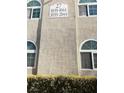Building exterior featuring address numbers and arched windows at 3145 E Flamingo Rd # 1043, Las Vegas, NV 89121