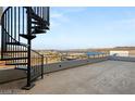 Private deck with spiral staircase and lake view at 36 Rainbow Point Pl, Henderson, NV 89011
