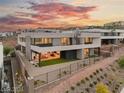 Modern home exterior with backyard and sunset view at 36 Rainbow Point Pl, Henderson, NV 89011