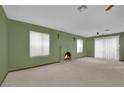 Bright living room featuring a fireplace and neutral color palette at 5261 S Sandhill Rd, Las Vegas, NV 89120