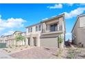 Two story house with balcony, attached garage and landscaped front yard at 10224 Eden Mountain St, Las Vegas, NV 89141