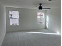 Spacious bedroom with carpeted floors and large windows offering ample natural light at 2753 Piazza Madama St, Henderson, NV 89044