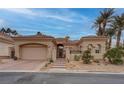 Charming single-story home featuring a desert landscape, tile roof, and inviting curb appeal at 36 Avenida Fiori, Henderson, NV 89011