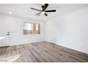 Bright living room with vinyl plank flooring and ceiling fan at 5061 Pioneer Ave # 104, Las Vegas, NV 89146