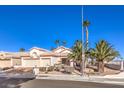 Single-story home with two-car garage and desert landscaping at 1046 Weatherboard St, Henderson, NV 89011