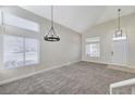 Bright living room featuring a high ceiling and neutral decor at 115 Muddy Creek Ave, Las Vegas, NV 89123