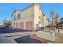 Building exterior with attached garages and ample parking at 1405 S Nellis Blvd # 2093, Las Vegas, NV 89104