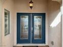 Elegant double front doors with glass panels add curb appeal at 2624 Torch Ave, North Las Vegas, NV 89081