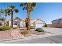 Attractive single-story home with a tiled roof, desert landscaping, and a stone walkway to the front door at 368 E Rush Ave, Las Vegas, NV 89183