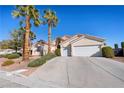 Inviting single-story home with well-maintained landscaping and a spacious driveway leading to a two-car garage at 368 E Rush Ave, Las Vegas, NV 89183