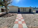 Checkered walkway leading to the entrance of a ranch home at 4911 Lana Dr, Las Vegas, NV 89121