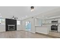 Modern kitchen with white shaker cabinets, stainless steel appliances, and quartz countertops at 4918 Schumann Dr, Las Vegas, NV 89146