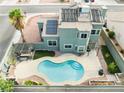 Aerial view of backyard with a refreshing private pool, pergola covered grill, and easy-care desert landscaping at 6112 Browning Way, Las Vegas, NV 89130
