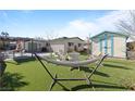 Backyard with artificial turf, hammock, and shed at 6214 Gunderson Blvd, Las Vegas, NV 89103