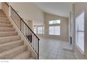 Carpeted staircase with metal railing leading to the upper level at 6516 Hartwood Rd, Las Vegas, NV 89108