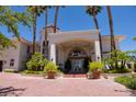 Mediterranean style home with tile roof, grand entrance, and lush landscaping at 66 Innisbrook Ave, Las Vegas, NV 89113