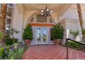 Elegant double front doors with terracotta tile flooring and ornate details at 66 Innisbrook Ave, Las Vegas, NV 89113