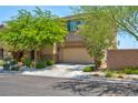 Two-story house with attached garage and landscaping at 7906 Woolly St, Las Vegas, NV 89149
