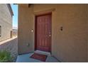 Exterior front door with a welcome mat at 7906 Woolly St, Las Vegas, NV 89149