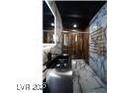 Modern bathroom with sleek dark vanity and patterned floor at 924 S First St # 510, Las Vegas, NV 89101