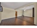 Open-concept living room with hardwood floors, neutral paint, and a ceiling fan for added comfort at 111 Manganese St, Henderson, NV 89015