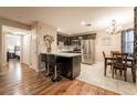 Bright, open kitchen and dining area with stainless steel appliances and breakfast bar at 1321 Cinder Rock Dr # 202, Las Vegas, NV 89128