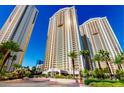 High-rise residential building with palm trees and city views at 135 E Harmon Ave # 3416, Las Vegas, NV 89109