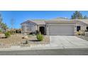 One-story home with attached garage and desert landscaping at 1474 Fieldbrook St, Henderson, NV 89052