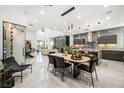 Modern kitchen with island, stainless steel appliances, and wine storage at 2824 Queens Courtyard Dr, Las Vegas, NV 89109