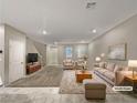 Spacious living room with tiled floors and neutral color palette at 3206 Brynley Ave, Henderson, NV 89044