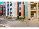 Modern building exterior with walkway and landscaping at 38 E Serene Ave # 416, Las Vegas, NV 89123