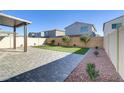 Artificial turf, covered patio, and block wall at 5612 Hill Cliff Ct, North Las Vegas, NV 89031