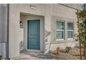 House exterior with teal front door and gray siding at 639 Morbucks Ln # 1044, Henderson, NV 89011