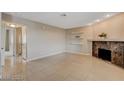Living room with fireplace and tile floors at 916 Rockview Dr # 201, Las Vegas, NV 89128