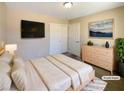Spacious bedroom with large bed, dresser, and mounted TV at 9801 Fast Elk St, Las Vegas, NV 89143