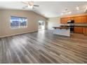 Open concept living room and kitchen with hardwood floors at 9801 Fast Elk St, Las Vegas, NV 89143
