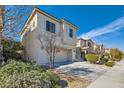 Charming two-story home featuring a two-car garage and a well-manicured, landscaped front yard at 10997 Sardinia Sands Dr, Las Vegas, NV 89141