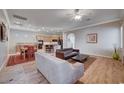 Bright and airy living room with hardwood floors and open floor plan at 2428 Granada Bluff Ct, Las Vegas, NV 89135