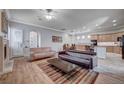 Open living room with views into the kitchen and dining area at 2428 Granada Bluff Ct, Las Vegas, NV 89135